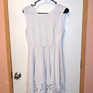 White dress with rose cutouts on bottom